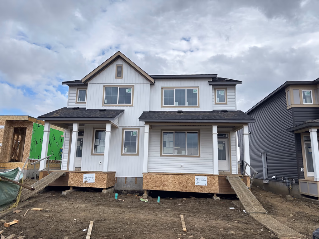 New two-storey build with board-and-batten siding installed by our crew